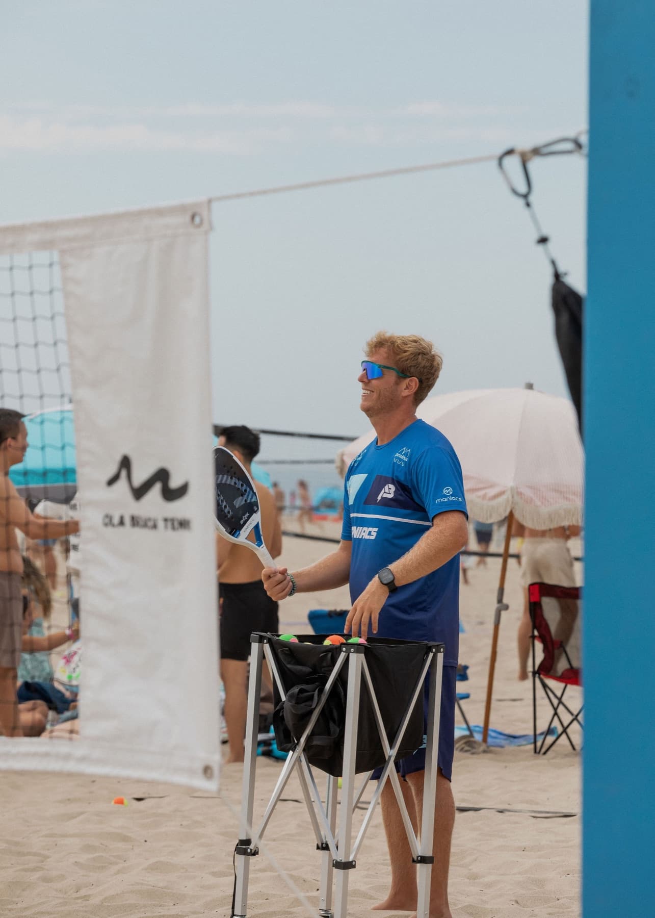 OLA Academy coach on the beach, ready to feed balls