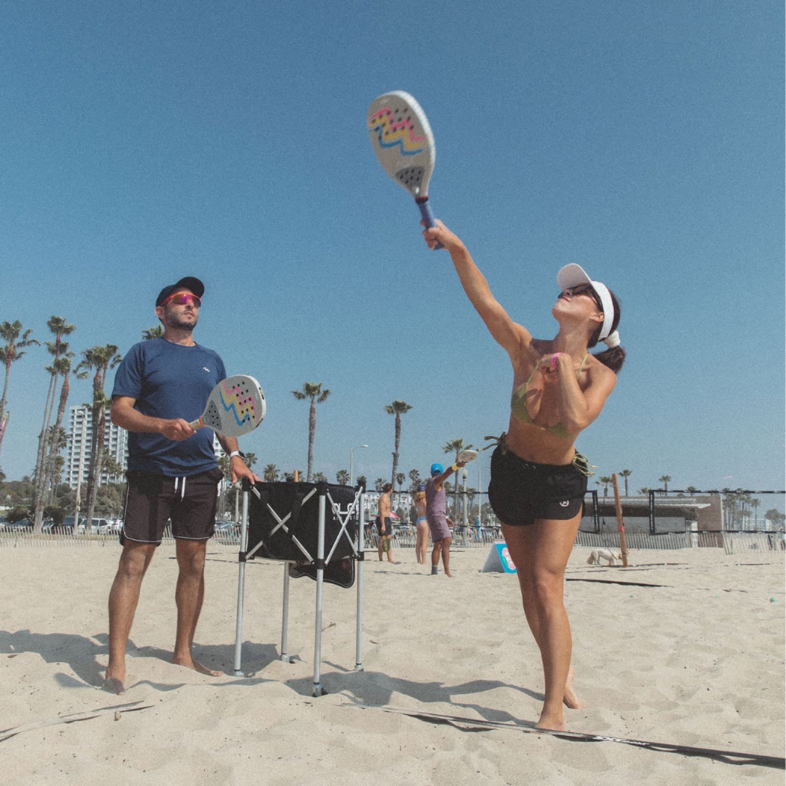 OLA coach working with a beginner on the beach